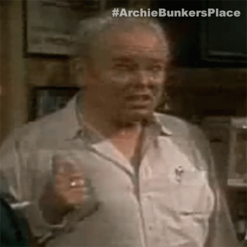Older Man in White Shirt Holding Wine Glass Making Funny Face
