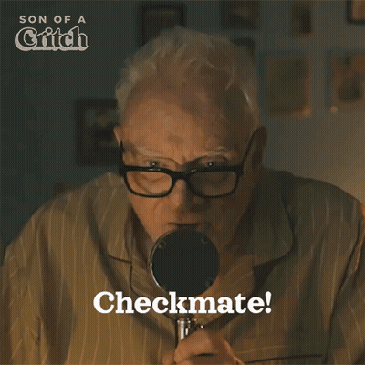 Older Man Looking Through Magnifying Glass GIF