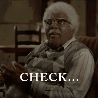 Older Man on Couch With Check