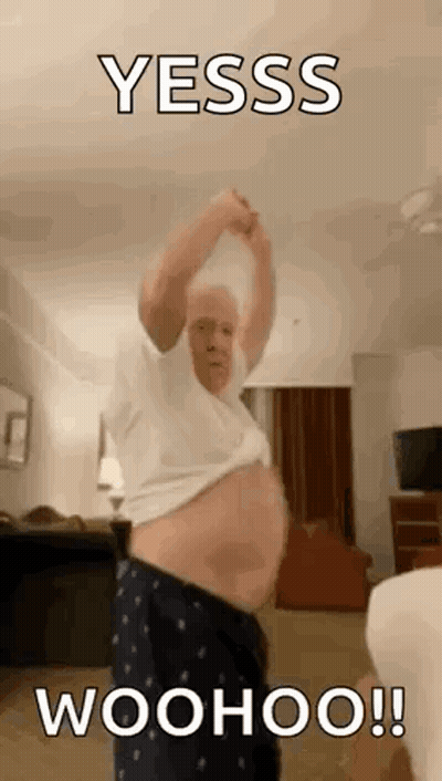 Older Man Standing Shirtless In Living Room GIF