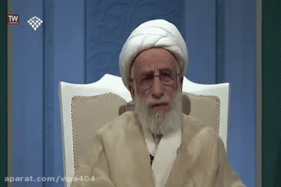 Older Man With Beard And Glasses Sitting GIF