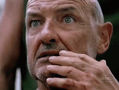 Older Man With Beard Covering Mouth GIF