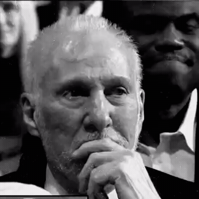 Older Man With Beard In Crowd GIF