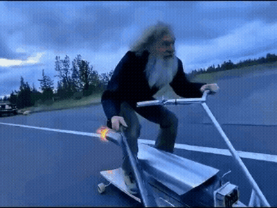 Older Man With Beard Riding Skateboard GIF