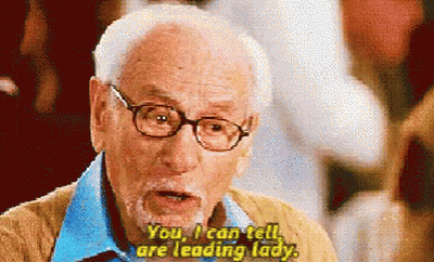 Older Man With Glasses And Beard Says Leading Lady GIF