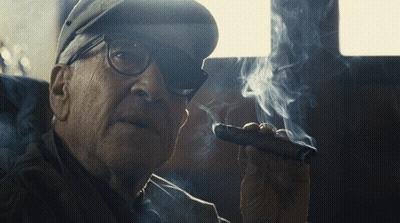 Older Man With Glasses And Hat Smoking Cigar GIF