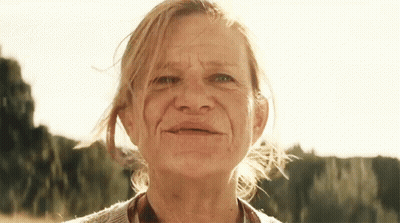 Older Woman Close Up With Trees GIF