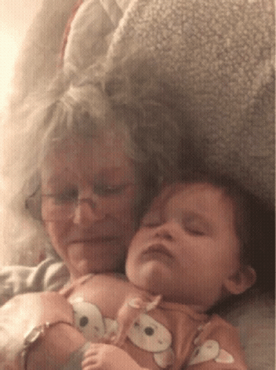 Older Woman Holding Baby GIF