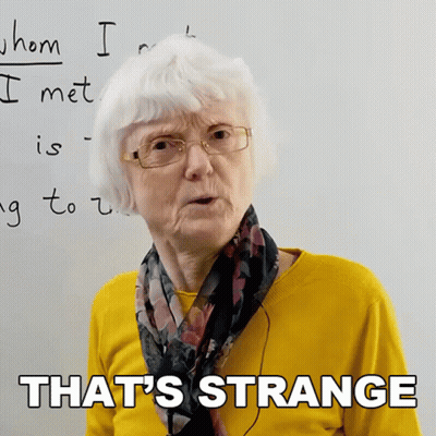 Older Woman In Glasses And Yellow Sweater Says That's Strange GIF