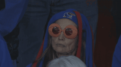 Older Woman In Sunglasses And Blue Hat With Letter A GIF