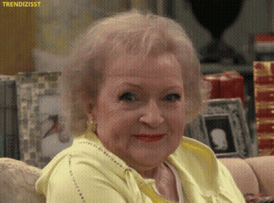 Older Woman In Yellow Sweater And Red Lipstick GIF