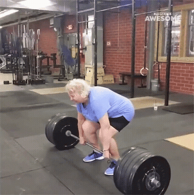 Older Woman Lifting Barbell At Gym With Awesome Text GIF