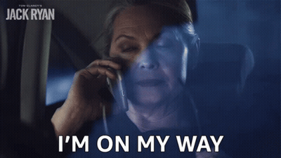 Older Woman On Cell Phone Saying I'm On My Way GIF