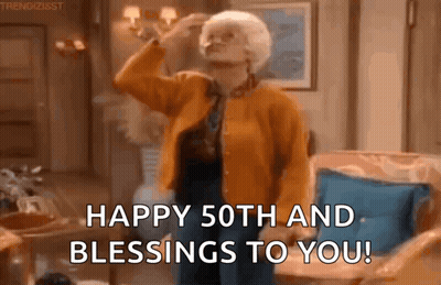 Older Woman Standing In Living Room With Hand On Forehead GIF