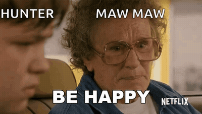 Older Woman With Glasses Sitting Next To Boy Saying Be Happy GIF