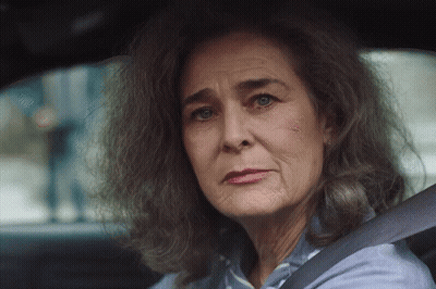 Older Woman With Gray Hair Sitting In Car GIF