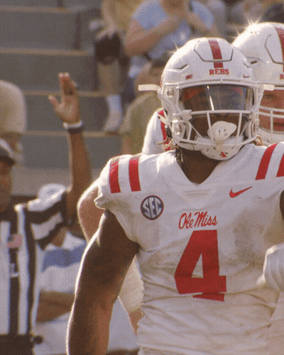 Ole Miss Football Player In White Jersey With Red Stripes GIF