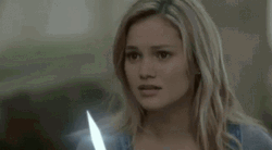 Olivia Holt Holding Dagger GIF