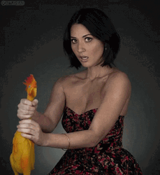 Olivia Munn Holding Chickens Neck GIF