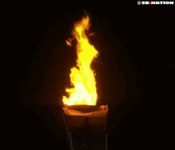 Olympic Torch In The Dark GIF