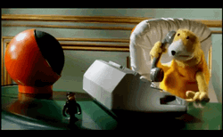 On Hold Yellow Puppet In Table GIF