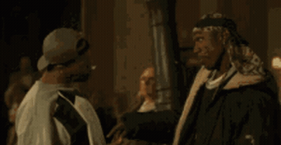 One Man Saying Popcorn To Another GIF