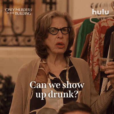 Only Murders In The Building Ad Woman Holding Glass GIF