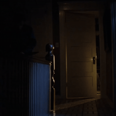 Open Door In Dark Hallway With Staircase GIF