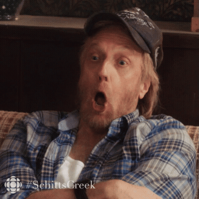 Open-Mouthed Man In Hat And Plaid Shirt GIF