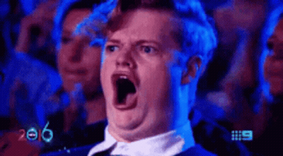 Open-Mouthed Man Watching Show In Crowd GIF
