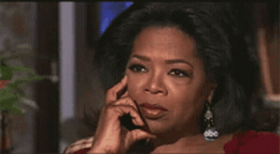 Oprah Winfrey Talking On A Cell Phone With Her Hand On Her Chin GIF