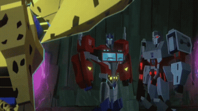 Optimus Prime And Megatron Standing In Dark Room GIF
