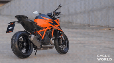 Orange And Black KTM Motorcycle Parked On Road GIF