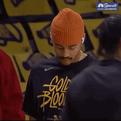 Orange Beanie And Black Shirt Man On Phone GIF