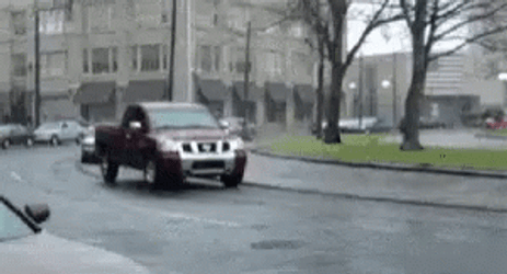 Orange Hellcat Drifting Beside Moving Cars GIF