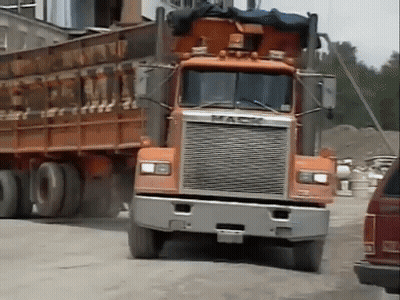 Orange Mack Truck Driving GIF
