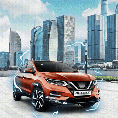 Orange Nissan Helioz Parked In Front Of City Skyline GIF