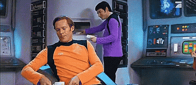 Orange Shirt Man Sits, Purple Shirt Man Works GIF