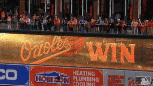 Orioles Win Is Displayed On A Large Screen In Front Of A Crowd GIF