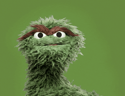 Oscar The Grouch From Sesame Street Is Covering His Face With His Hand GIF