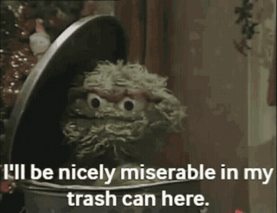 Oscar The Grouch From Sesame Street Says " I 'Ll Be Nicely Miserable In My Trash Can Here " GIF