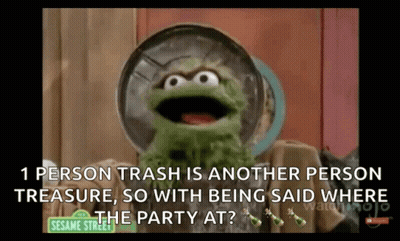Oscar The Grouch Holding Trash Can Over Head GIF