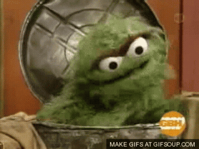 Oscar The Grouch Sitting In Trash Can GIF