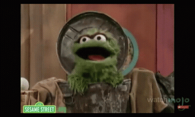 Oscar The Grouch Standing In Trash Can GIF