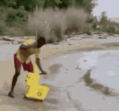 Ostrich Doing Trick With Feathers Spread In Desert GIF