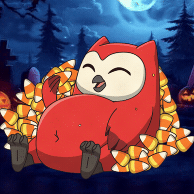 Owl Laying On Pile Of Candy Corn GIF