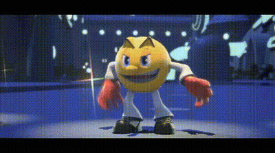 Pac Man Is Wearing Boxing Gloves And Standing On A Stage GIF