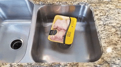 Package Of Chicken Wings In Sink GIF