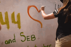 Painting Big Heart On A Wall GIF