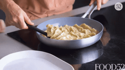 Pan Of Food Cooking On Stove With Number 52 GIF